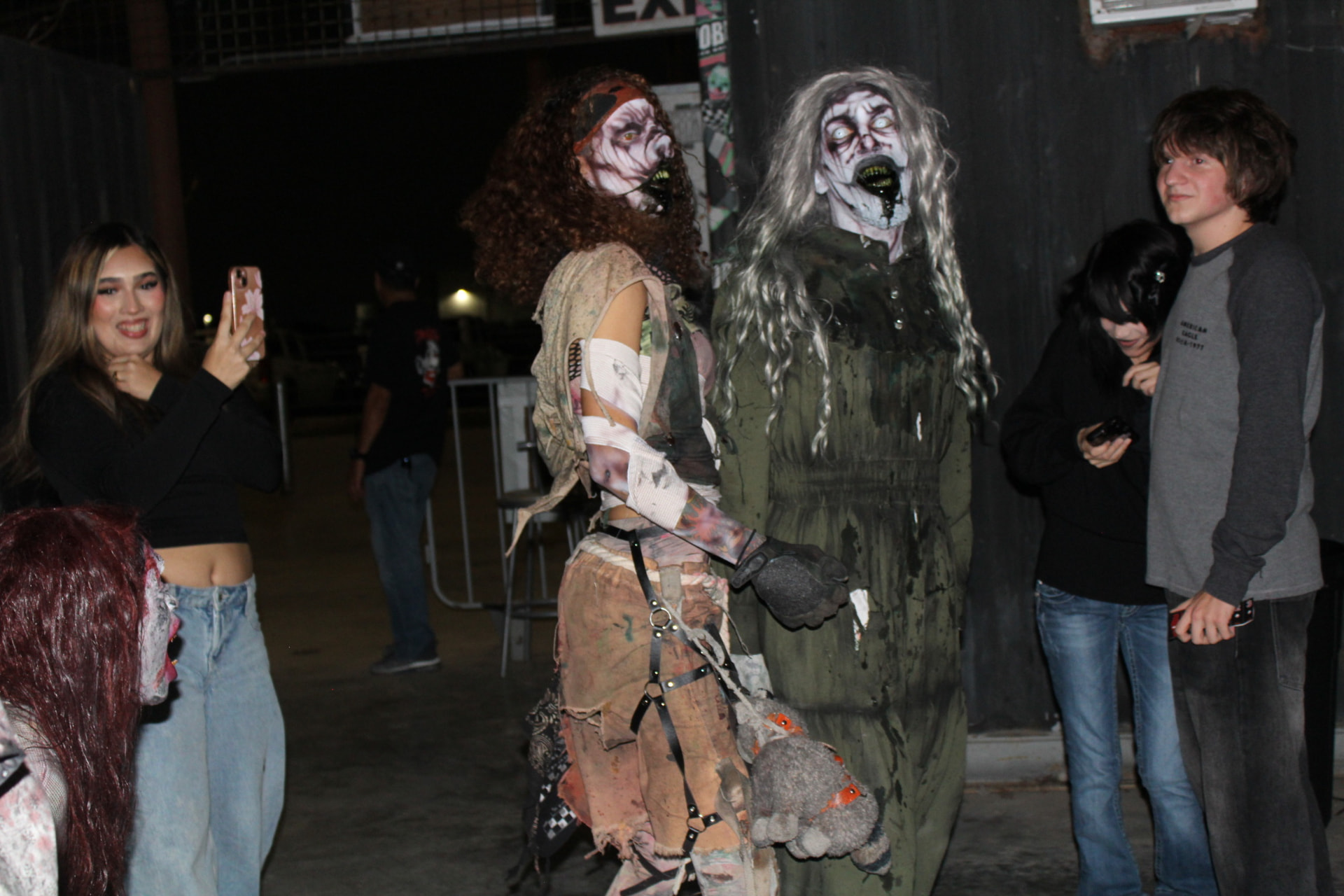Vanity and Lucy Scroo posing with guests at Phobia Haunt