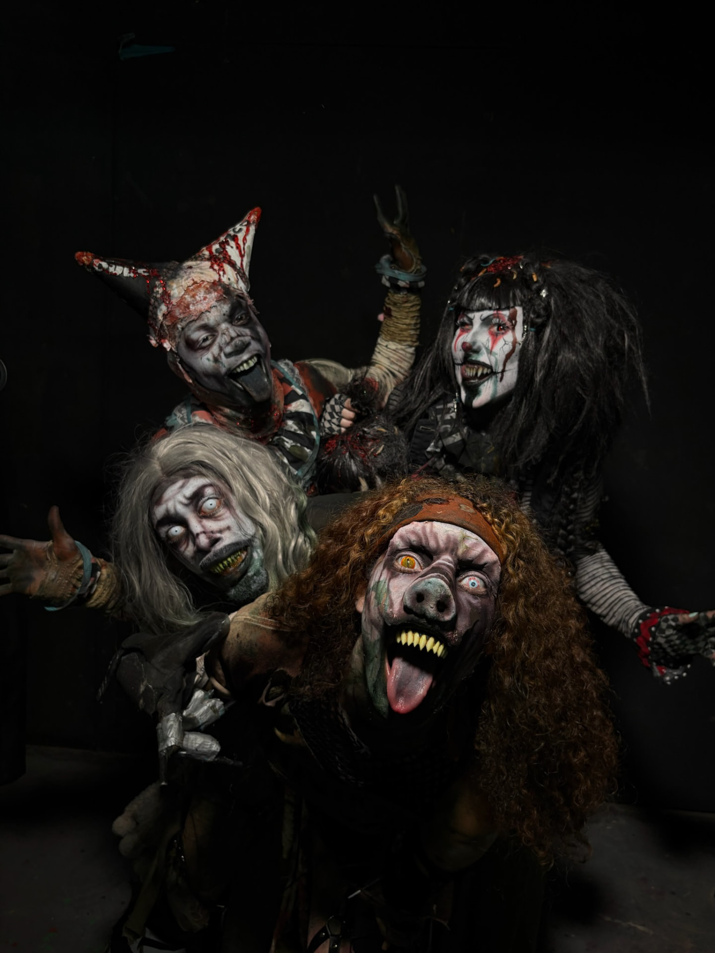 Vanity, Lucy Scroo and Flix the Clown reaching for the camera at Phobia Haunt