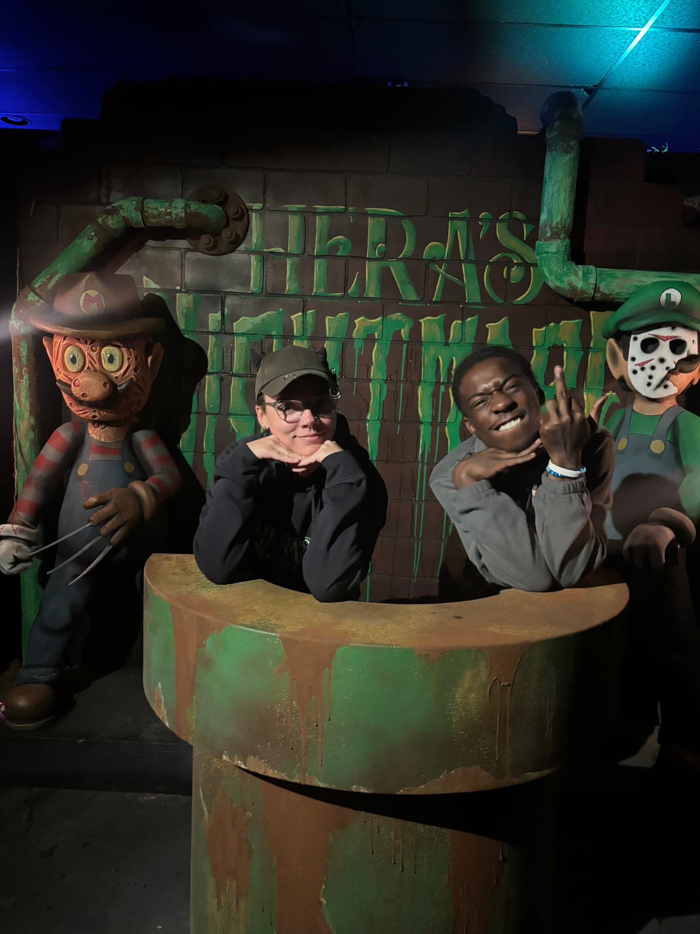 The cast posing in the pipe photo op at Hera's Nightmare in Westminster