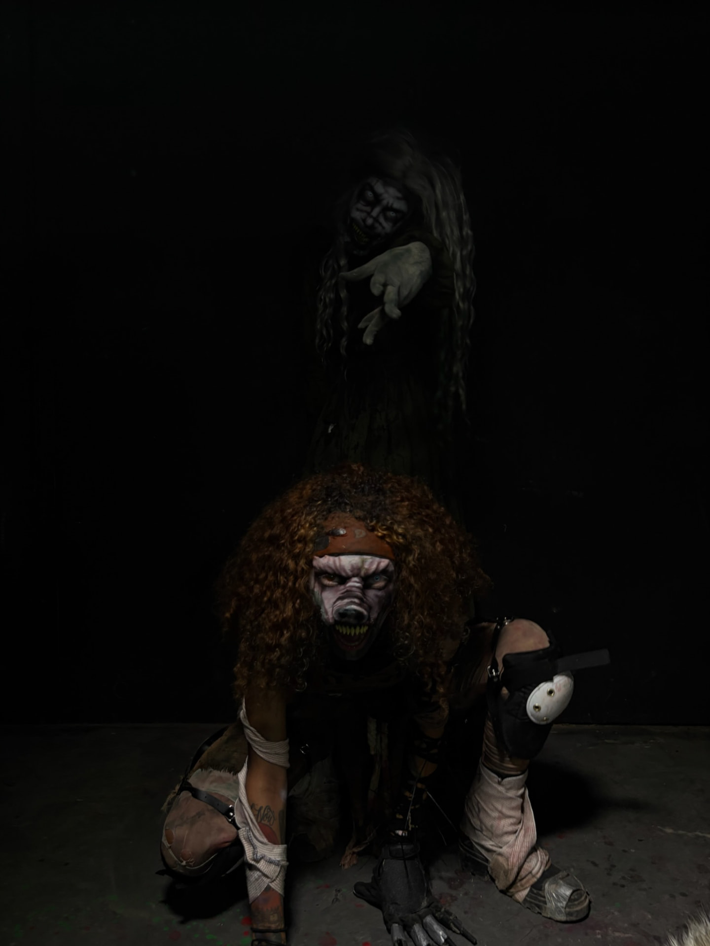 Lucy Scroo and Vanity crawling out of the dark at Phobia Haunt